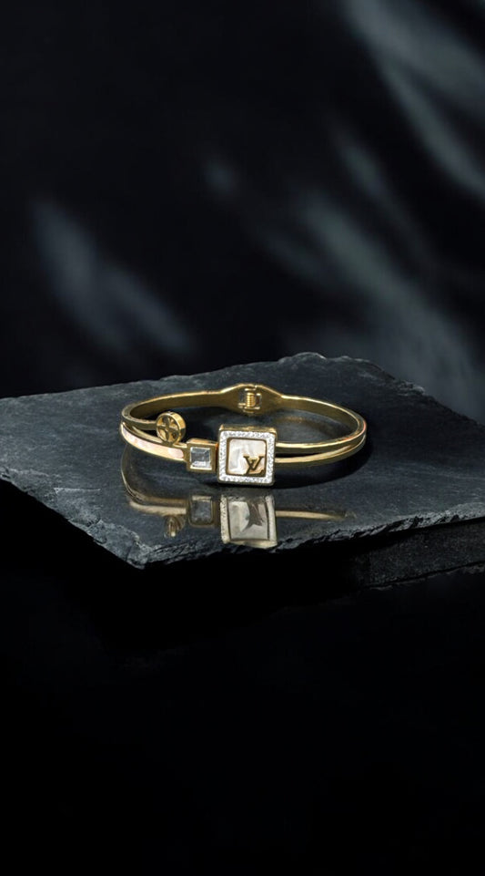The White L and V Bangle